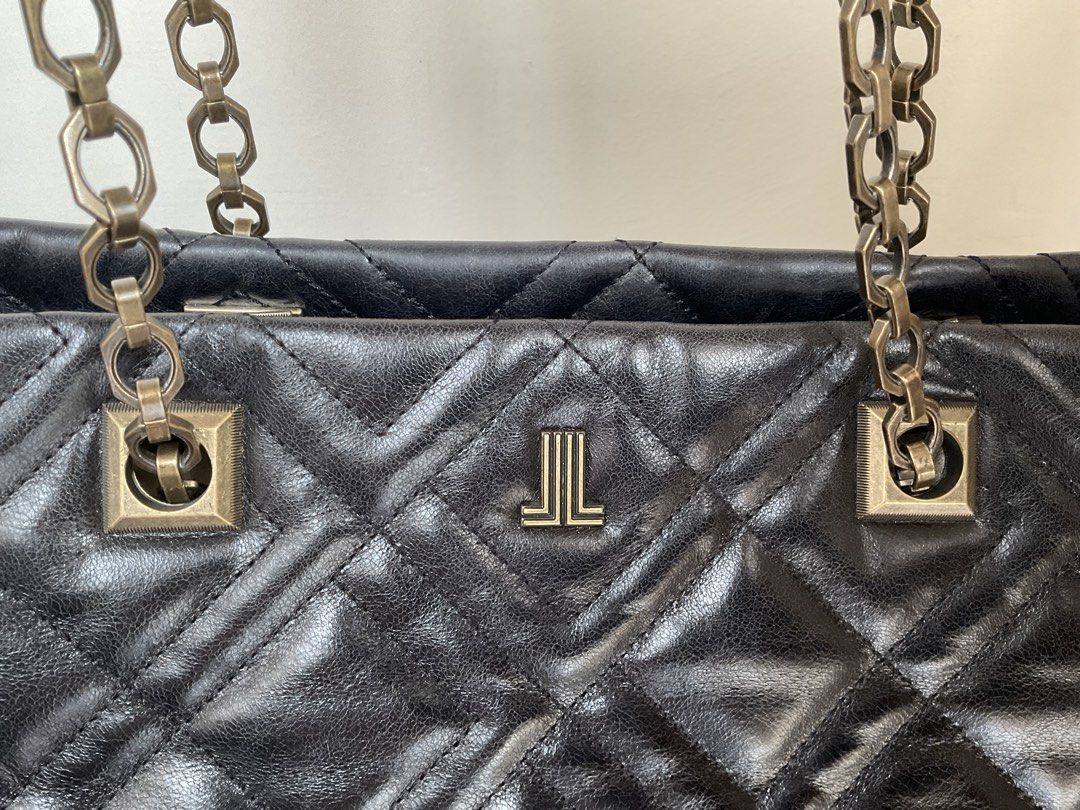 Auth Lanvin tote bag (Category: Luxury Bags & Wallets) located in Caloocan City. Submitted by siftedthriftedph (Listing ID 1444009332, Image 2). Description: - Elegant classic quilted tote with chain straps - In black quilted distressed leather in brass vintage hardwares - L-15in x H-11in - Very good condition.
