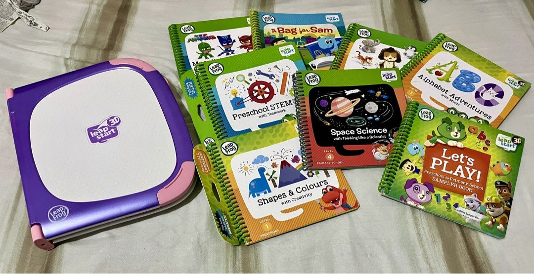 LeapFrog LeapStart 3D Learning System with 7 Books (Category: Educational & Learning Toys) located in Manila. Submitted by supermowm (Listing ID 1444077179, Image 1). Description: - LeapFrog LeapStart 3D learning system in purple and pink. - Includes 7 interactive books for engaging learning. - Covers subjects like STEM, Space Science, ABCs, Shapes & Colours, and more. - Ideal for preschool and primary school children. - Books included: 'A Bag fo