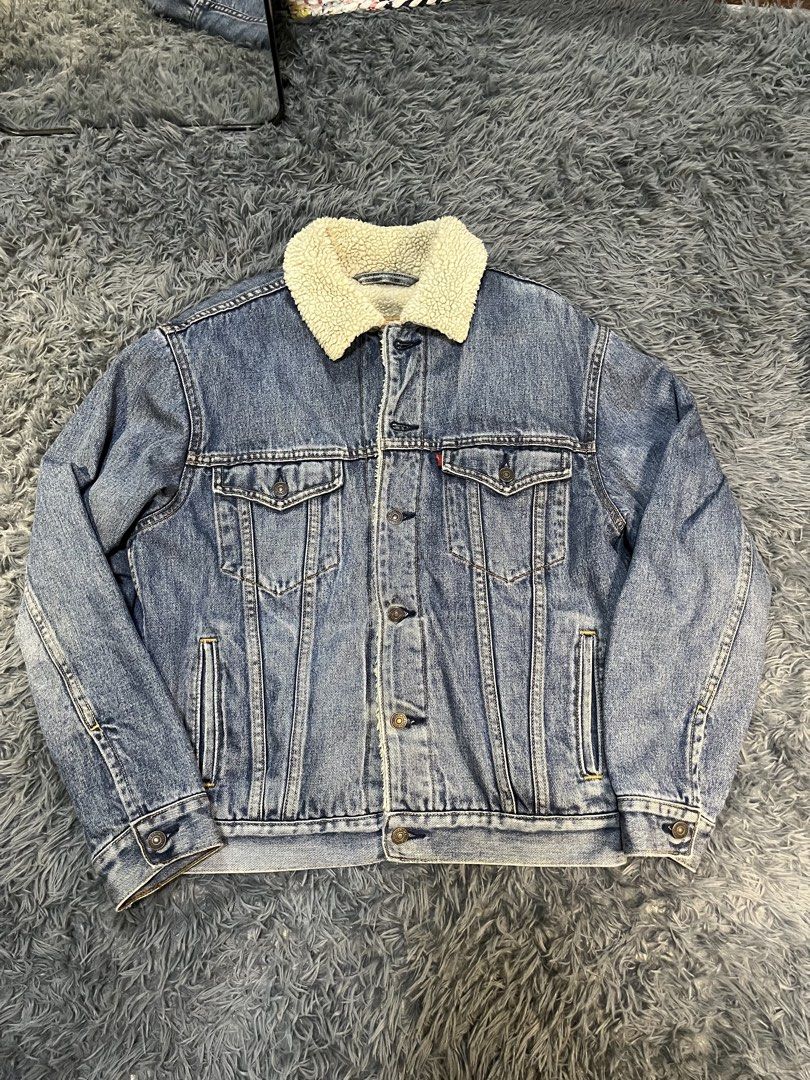 Levi's Original Riveted Denim Sherpa Trucker Jacket (Category: Coats, Jackets and Outerwear) located in Caloocan City. Submitted by leo.noelalonzo (Listing ID 1444079206, Image 1). Description: - Classic Levi's denim jacket - Sherpa lined for extra warmth - Original riveted quality construction - Standard trucker style - Size: Medium (M) - Ideal for cooler weather - Durable denim build.