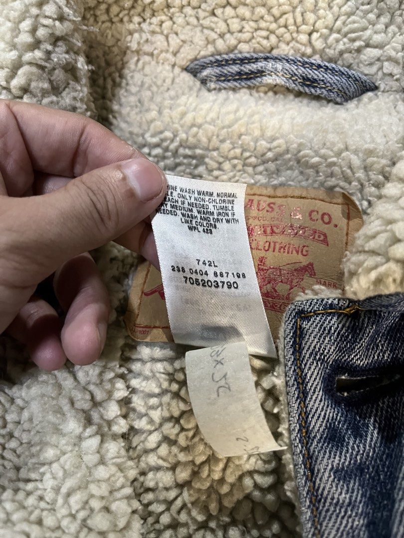 Levi's Original Riveted Denim Sherpa Trucker Jacket (Category: Coats, Jackets and Outerwear) located in Caloocan City. Submitted by leo.noelalonzo (Listing ID 1444079206, Image 3). Description: - Classic Levi's denim jacket - Sherpa lined for extra warmth - Original riveted quality construction - Standard trucker style - Size: Medium (M) - Ideal for cooler weather - Durable denim build.