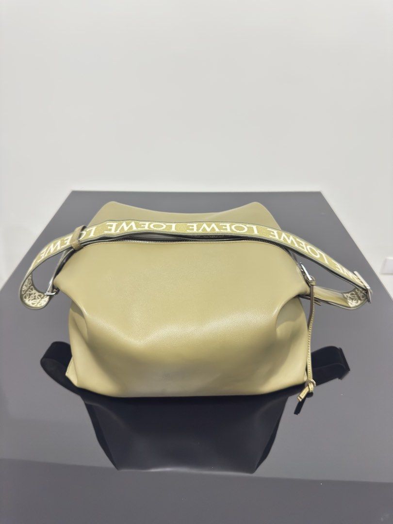 Loewe Cubi Bag Medium (Category: Luxury Bags & Wallets) located in Manila. Submitted by vaughnmorales (Listing ID 1443928938, Image 1). Description: - Loewe Hammock bag - Color: Olive Green - Material: Leather - Strap: Features repeating Loewe logo - Closure: Zipper - Interior: Black - Features: Plenty of space, great for everyday use.