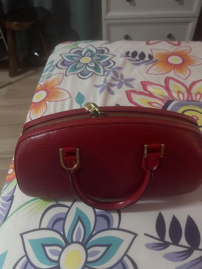 Louis Vuitton Epi Leather Red Handbag (Category: Luxury Bags & Wallets) located in Pasig City. Submitted by cecilececile4361 (Listing ID 1443954086, Image 3). Description: - Authentic Red Louis Vuitton Handbag - Durable Epi Leather - Elegant Gold Hardware - Secure Zipper Closure - Convenient Interior Pocket - Sturdy Handles for Everyday Use - Versatile for Casual or Formal Occasions - Comes with Original Dust Bag.