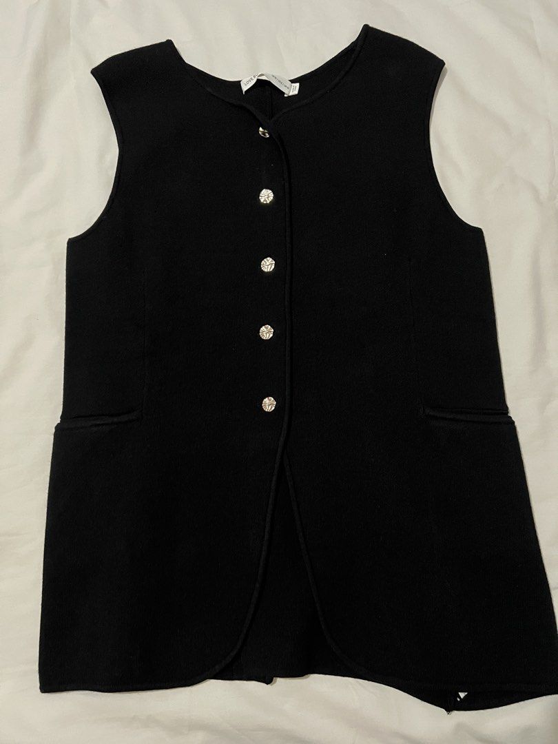 Love Bonito Knit Vest Top (Category: Sleeveless) located in Pasig City. Submitted by shop.rdm (Listing ID 1444087567, Image 1). Description: - Black sleeveless vest - Round neckline - Button-up front with rhinestone buttons - Two front pockets - Subtle hemline split - Ideal layering piece for any outfit - Never been used; just fitted.
