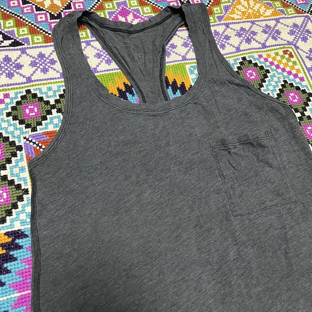 Lululemon Grey Racerback Tank Top with Pocket (Category: Activewear) located in Dagupan City. Submitted by vernzkee (Listing ID 1443969768, Image 2). Description: Size 4 - Grey Lululemon tank top - Racerback style - Small pocket on left chest - Soft, breathable fabric - Ideal for workouts or casual wear - Curved hemline Location: Dagupan City, Pangasinan MOP: Gcash, Maya, BPI, BDO or Gotyme Shipping via JnT.