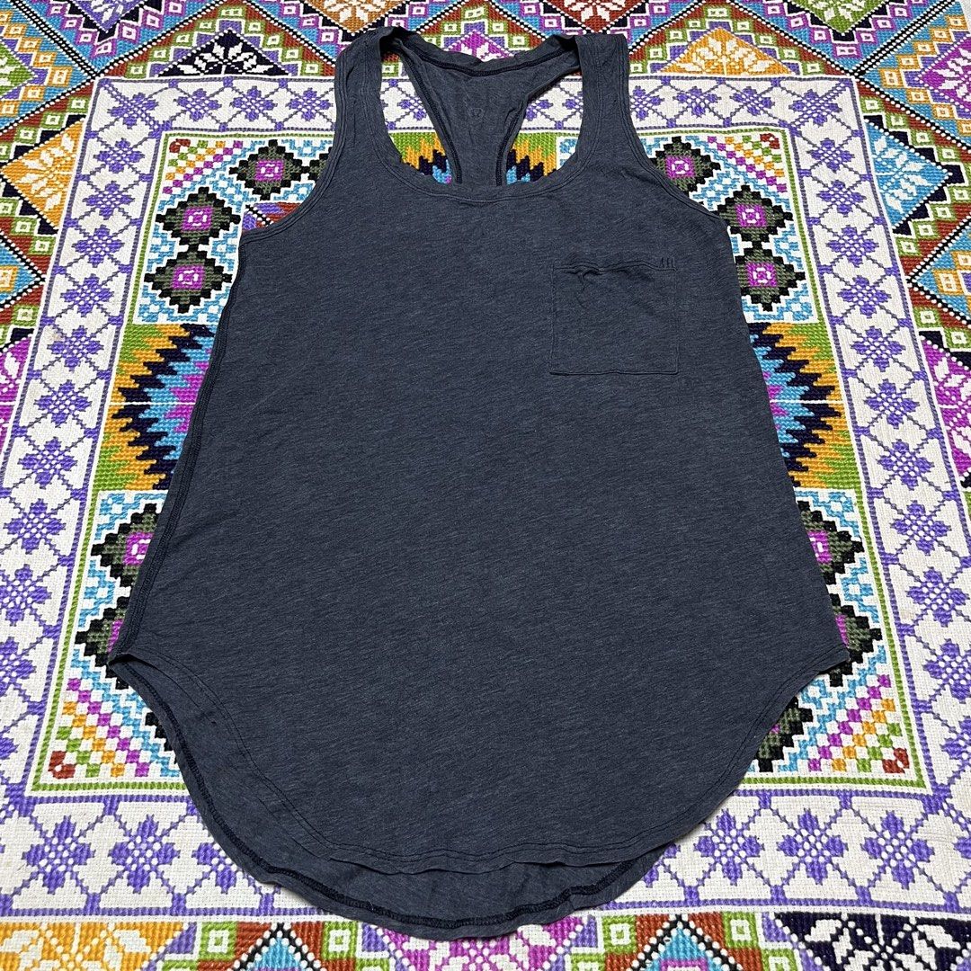 Lululemon Grey Racerback Tank Top with Pocket (Category: Activewear) located in Dagupan City. Submitted by vernzkee (Listing ID 1443969768, Image 1). Description: Size 4 - Grey Lululemon tank top - Racerback style - Small pocket on left chest - Soft, breathable fabric - Ideal for workouts or casual wear - Curved hemline Location: Dagupan City, Pangasinan MOP: Gcash, Maya, BPI, BDO or Gotyme Shipping via JnT.