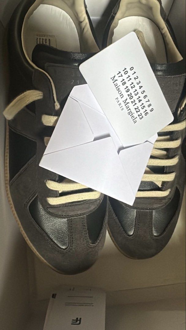 Maison Margiela Black & Brown Gats (Category: Sneakers & Footwear) located in Quezon City. Submitted by jamessfoundwhatt (Listing ID 1444019777, Image 2). Description: • Used 4 times • High Quality UA • 10/10 Condition • No issues •EUR 42/US 9-9.5 • Rfs: Not quite my preferred color-way • Negotiable Price for sure buyers • Buyer’s Shoulder SF via lalamove/J&T.