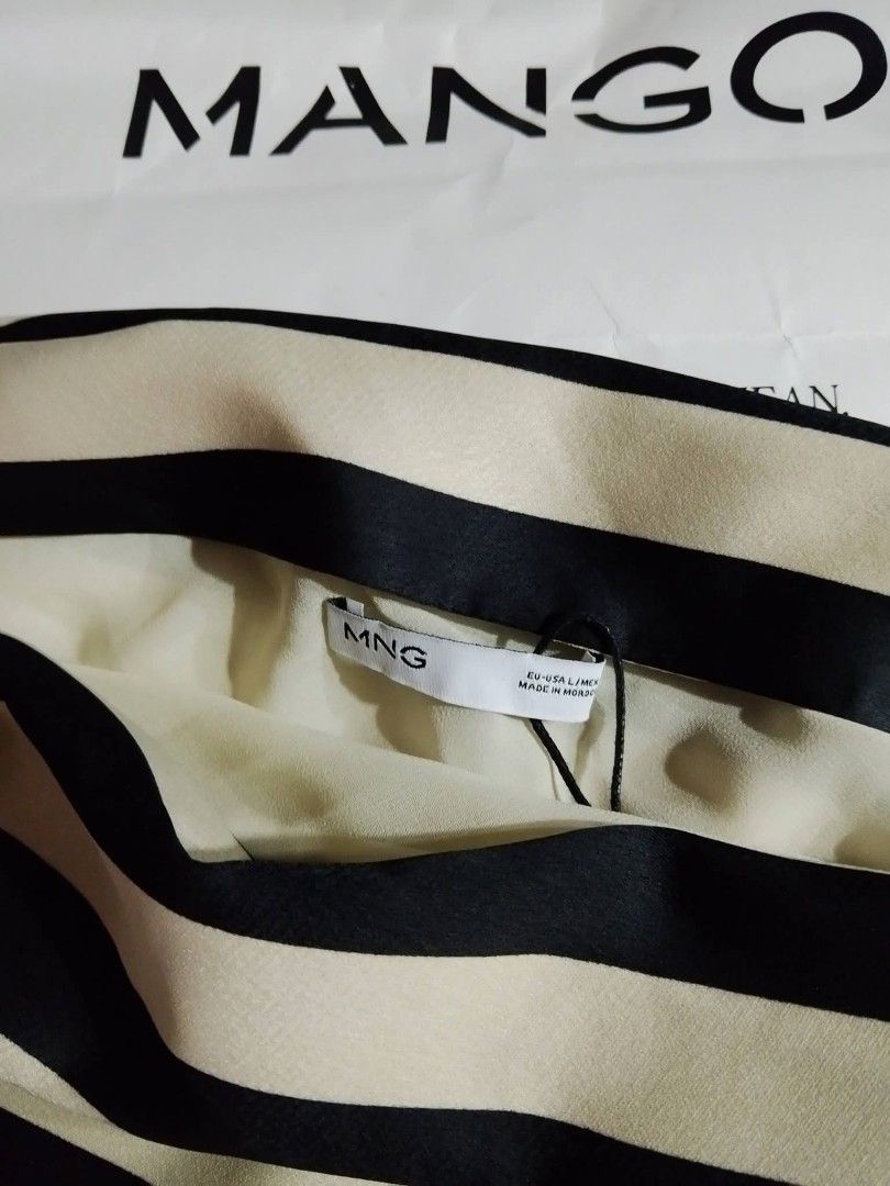Mango Striped Asymmetrical Halter Top (Category: Sleeveless) located in Manila. Submitted by declutteraf (Listing ID 1443944310, Image 2). Description: Price Negotiable! - Brand: Mango - Size: L - Color: Black and beige stripes - Neckline: Asymmetrical - Condition: Brand new with tags, never worn - Original Price: PHP 2,495.