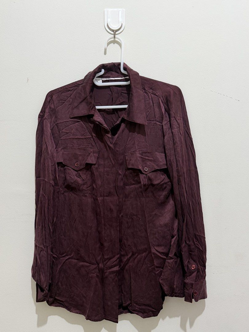 Maroon Long Sleeve Button Up Shirt with Pockets (Category: Tshirts & Polo Shirts ) located in Pasay City. Submitted by petiteprelovecloset (Listing ID 1444082858, Image 1). Description: - Maroon long sleeve shirt - Two chest pockets with button closures - Button cuffs on sleeves - Subtle textured fabric pattern - Relaxed fit - Ideal for casual wear or layering or cover up -Oversize Polo -Office Top -Silk Maroon blouse -Office Polo -Button down To
