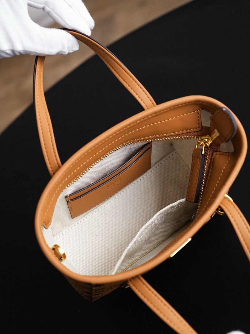 MCM Visetos Mini Tote Bag (Category: Luxury Bags & Wallets) located in Taguig. Submitted by ruinitotai74709 (Listing ID 1443982483, Image 2). Description: - Classic MCM mini tote bag - Signature Visetos print - Gold-tone hardware - Detachable strap for crossbody wear - Ideal size for essentials - Perfect for everyday use or travel.