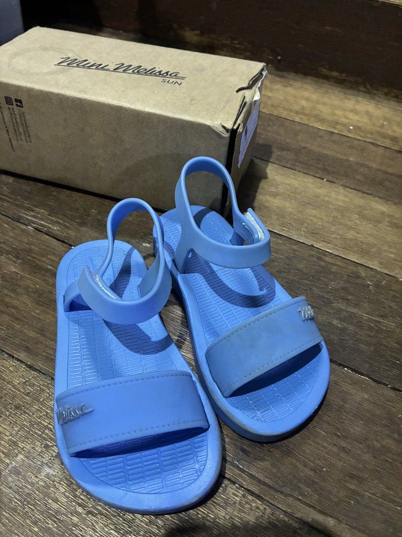 Mini Melissa Sun Laguna BB Blue Sandals (Category: Babies & Kids Fashion) located in Makati City. Submitted by xxchunkythecat (Listing ID 1443943517, Image 2). Description: - Blue Mini Melissa Sun Laguna BB sandals - Size USA 9/ EUR 25/26 - Easy velcro strap for adjustment - Durable rubber material, ideal for beach or pool - Includes original box and still has strong scent - Super cute and comfortable for little ones -Good as new, very nice in co