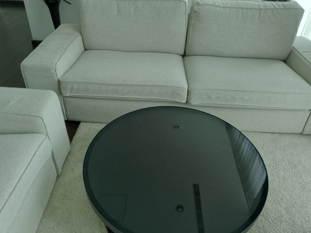 Modern White Sofa and Black Glass Coffee Table Set (Category: Tables & Sets) located in Manila. Submitted by tarah.malditah (Listing ID 1444043645, Image 1). Description: - Comfortable white sofa with a clean, modern design. - Sleek black glass coffee table with a round, reflective top. - Ideal for enhancing your living room space. - Sold as a set. - Pickup only..