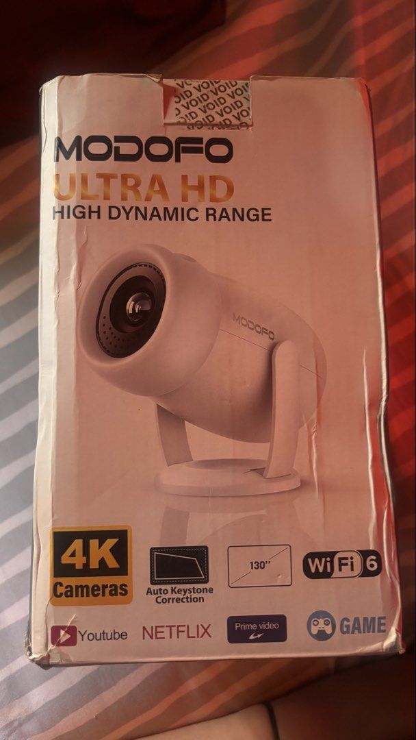 Modofo smart Projector (Category: Projectors) located in Angeles City. Submitted by riapreloved (Listing ID 1443979392, Image 2). Description: FOR SALE: Modofo Smart Projector 📽️ 💰 ₱4,000 only (bought for ₱5,500) ✅ Good condition ✅ WiFi-ready ✅ YouTube & Netflix ready Inclusions: • Remote • Power cord • HDMI cord RFS: Di na nagagamit..
