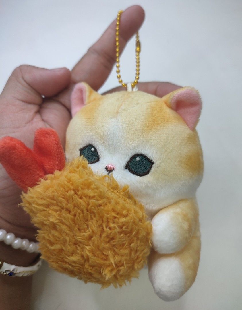 Mofusand tempura Plushie Charm (Category: Plushies & Soft Toys) located in Manila. Submitted by epicmountain-f20453 (Listing ID 1444107688, Image 2). Description: - Adorable orange and white cat plush toy. - Comes with a cute fried shrimp accessory. - Features a gold chain and clasp for easy attachment to bags or keys. - Part of a collection of charming animal plushies. - Ideal gift for cat enthusiasts and plush collectors..
