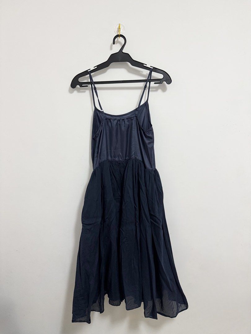 Navy Blue Slip Dress with Adjustable Straps (Category: Dresses) located in Makati City. Submitted by norisubi (Listing ID 1444073667, Image 2). Description: - Elegant navy blue slip dress - Satin-like material on the bodice with flowy - Adjustable spaghetti straps for a perfect fit - Minor issues with strap and fabric (see images for closer look) MOP: Gcash/Maribank/Bank Transfer (BDO) MOD: SDD via Lalamove/Grab/Angkas or J&T (sf shouldered by bu