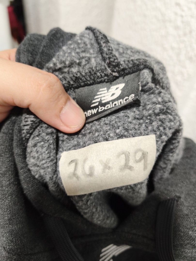 New Balance Grey Hoodie (Category: Hoodies) located in Iloilo. Submitted by daddy_declutter (Listing ID 1443930498, Image 3). Description: - Grey New Balance hoodie - Classic NB logo embroidered on chest - Features drawstring hood - Includes front pocket - Measurements: 26" width, 29" length - Ideal for casual everyday wear.