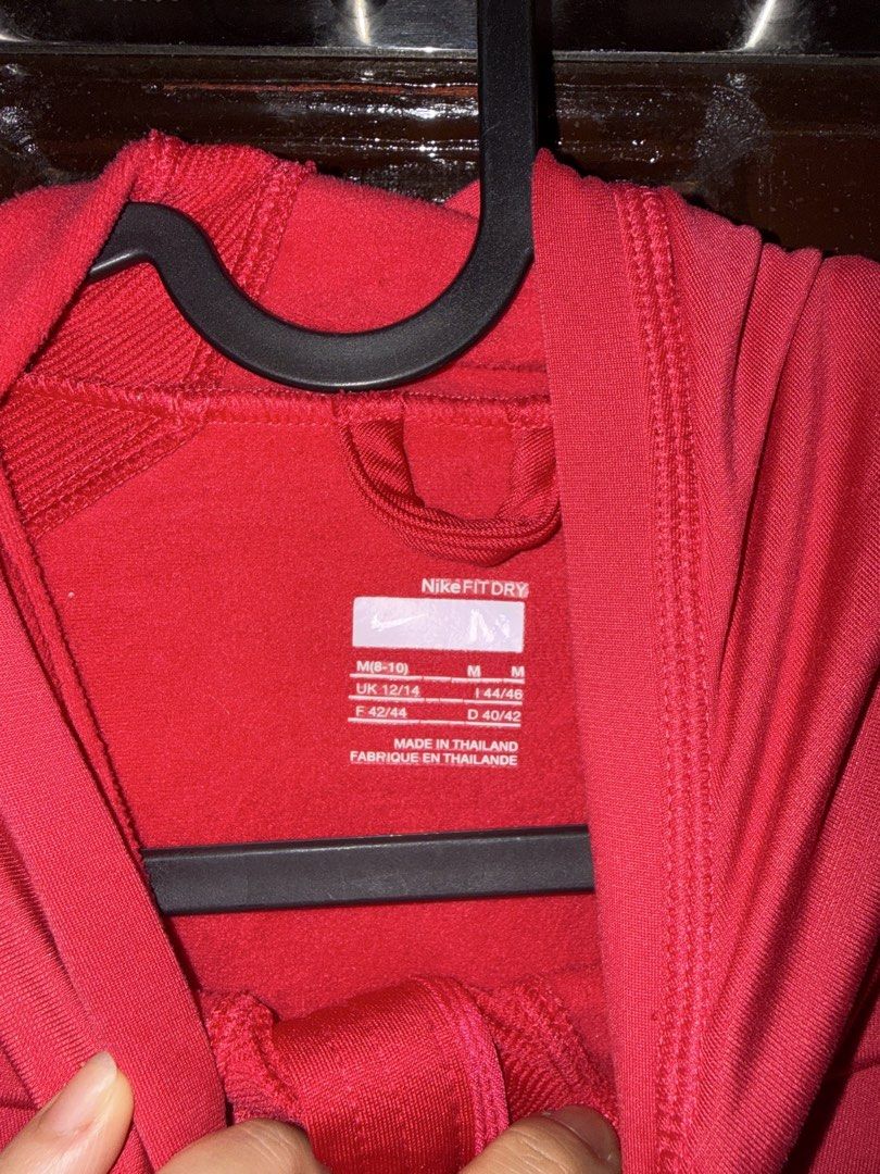Nike Dri-FIT Red Hoodie Pullover Size M (Category: Hoodies) located in Quezon City. Submitted by somethingshady (Listing ID 1443960485, Image 2). Description: - Red Nike Dri-FIT hoodie - Quarter zip pullover style with hood - Ideal for workouts and casual wear - Made in Thailand - Size: Medium.