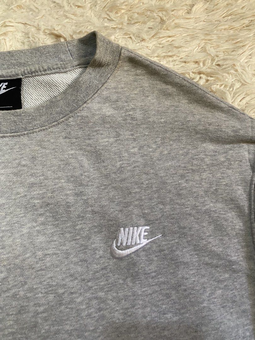 Nike Grey Crewneck Sweatshirt (Category: Coats, Jackets and Outerwear) located in Cebu City. Submitted by stevenkylegil (Listing ID 1443961088, Image 2). Description: Nike Clubfleece Sweatshirt Dimension W25 L28.5 Verygood Condition Color rate 9.5/10 No issue Dm to purchase.