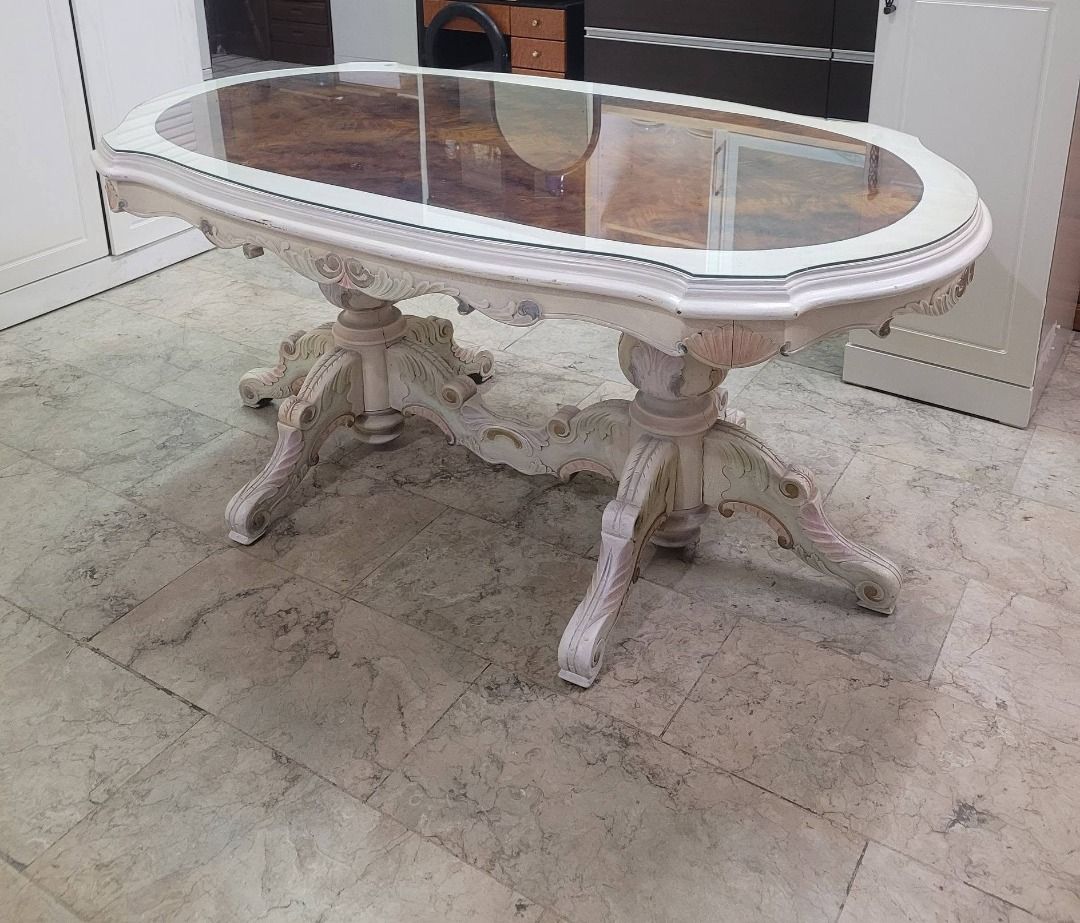 Oval Glass Top Dining Table with Ornate Base (Category: Tables & Sets) located in Quezon City. Submitted by japandemanila (Listing ID 1444039386, Image 3). Description: - Unique oval dining table with a vintage feel. - Features a beautiful glass top with decorative wood inlay underneath. - Ornate, carved wood base with a distressed white and gold finish. - Perfect for your dining room or as a stunning statement piece. JAPAN SURPLUS *6 Magdiwang s