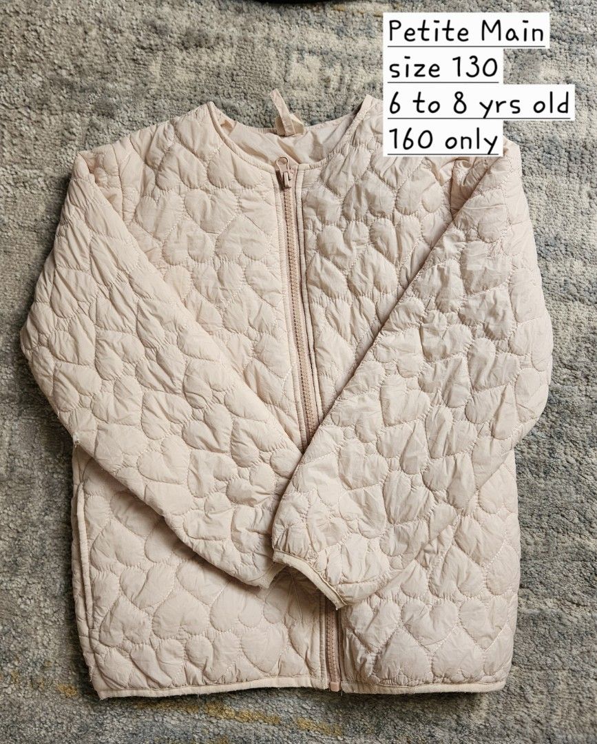 Petite Main Quilted Jacket Size 130 (6-8 yrs) (Category: Babies & Kids Fashion) located in Rizal. Submitted by vanbdc24 (Listing ID 1443979539, Image 1). Description: - Brand: Petite Main - Color: Light Pink - Style: Quilted Jacket - Pattern: All-over Heart Pattern - Closure: Zipper - Size: 130 (fits 6 to 8 years old) - Availability: Only 1 piece left - Ideal for: Cooler weather.
