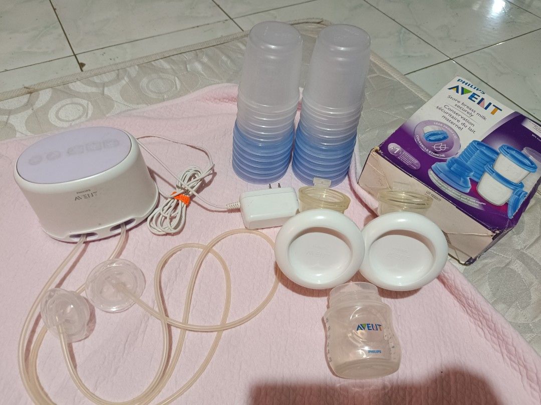 Philips Avent Electric Breast Pump with Storage Cups (Category: Breastfeeding & Bottle Feeding) located in Las Pinas. Submitted by anneguevarra0905 (Listing ID 1443932971, Image 3). Description: - Philips Avent electric breast pump set - Includes pump unit, power adapter, tubing, and breast shields - Comes with Avent milk storage cups - Everything you need to start pumping - Ideal for breastfeeding mothers - Sold as a complete set.