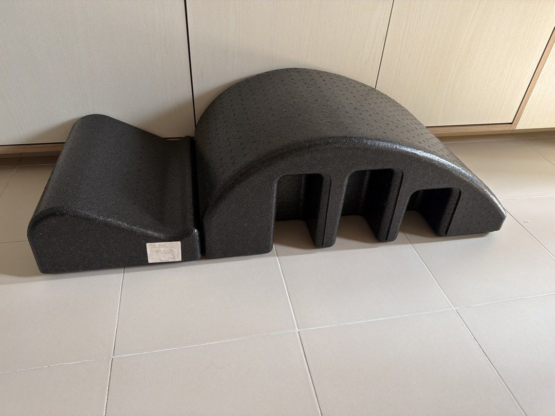 Pilates Arc Barrel Foam Roller (Category: Toning & Stretching Accessories) located in Singapore. Submitted by poohpoohworld (Listing ID 1443923855, Image 2). Description: - Black Pilates Arc Barrel - Made of dense, sturdy foam - Ideal for stretching and core strengthening - Versatile for multiple exercise positions - Suitable for home or studio use Good for stretching back.