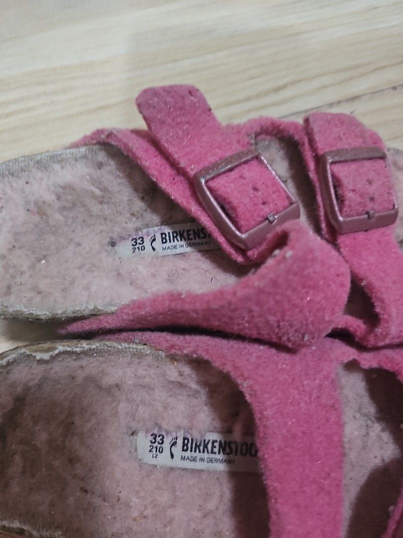 Pink Birkenstock Sandals Size 33 (Category: Babies & Kids Fashion) located in Cainta. Submitted by cyjozuza (Listing ID 1444023242, Image 2). Description: - Pink Birkenstock Sandals - Size 33 (fits 210mm) - Two adjustable straps with buckles - Comfortable cork footbed with fuzzy lining - Soles with good grip - Minor signs of wear on straps and footbed - Ideal for everyday wear.