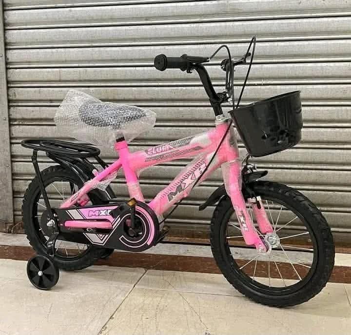 Pink MX Kids Bicycle with Training Wheels and Basket (Category: Bicycles) located in Makati City. Submitted by itsmedarling (Listing ID 1443987813, Image 1). Description: - Adorable pink bicycle perfect for kids - Includes training wheels for easy learning - Features a front basket for carrying essentials - Brand new seat still in plastic wrap - Ready for its first adventure with a new rider!.