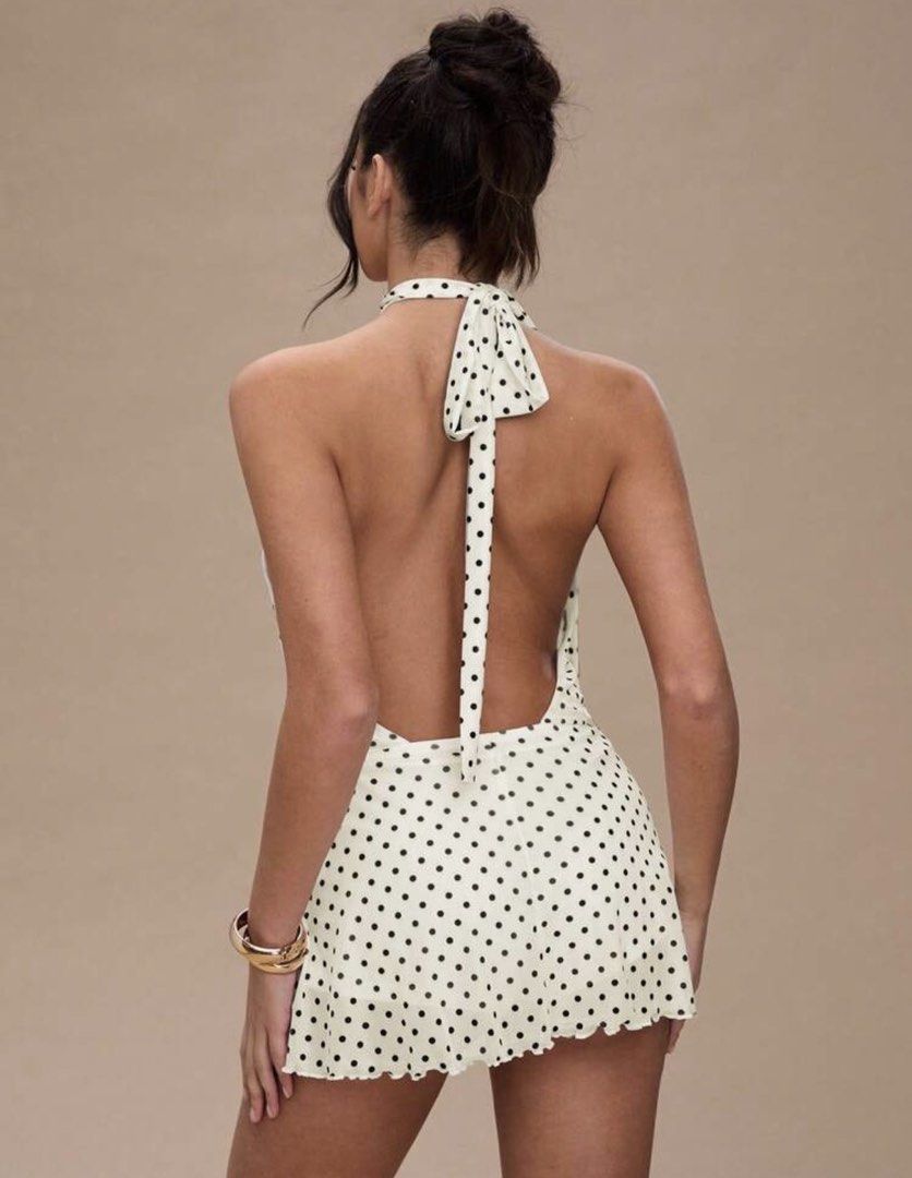 Polka Dot Halter Neck Mini Dress with Open Back (Category: Dresses) located in Pasig City. Submitted by mariamaria__ (Listing ID 1444103850, Image 2). Description: - USED ONCE - XS-S - Cream colored mini dress - Black polka dot pattern - Halter neck style - Open back with ties at the neck - Flattering fit - Perfect for parties or a night out - Pairs well with heels and a clutch.