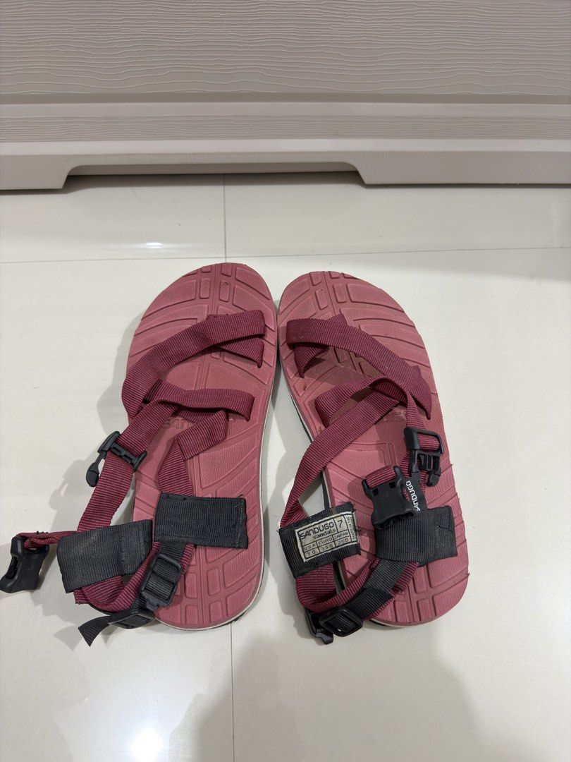 Sandugo 2 Adjustable Strap Outdoor Sandals (Category: Sandals) located in Manila. Submitted by maweezonline (Listing ID 1443991468, Image 1). Description: - Sandugo sandals in versatile maroon color. - Adjustable straps for a secure and comfortable fit. - Perfect for outdoor adventures or everyday casual wear. - Soles show some wear but have plenty of life remaining. - Known for comfort and durability..