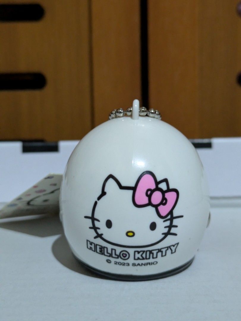 Sanrio Hello Kitty Mini Motorcycle Helmet Keychain Charm (Category: Character Goods) located in Batangas. Submitted by mirajane._ (Listing ID 1444088529, Image 3). Description: Official Sanrio Hello Kitty Mini Helmet Keychain 🤍 Adorable Hello Kitty keychain. 🤍 With original tag. 🤍 Authentic Sanrio product. This item is lightweight. Actual photos posted. Kindly set your expectations accordingly. What you see is what you get. Please review the a