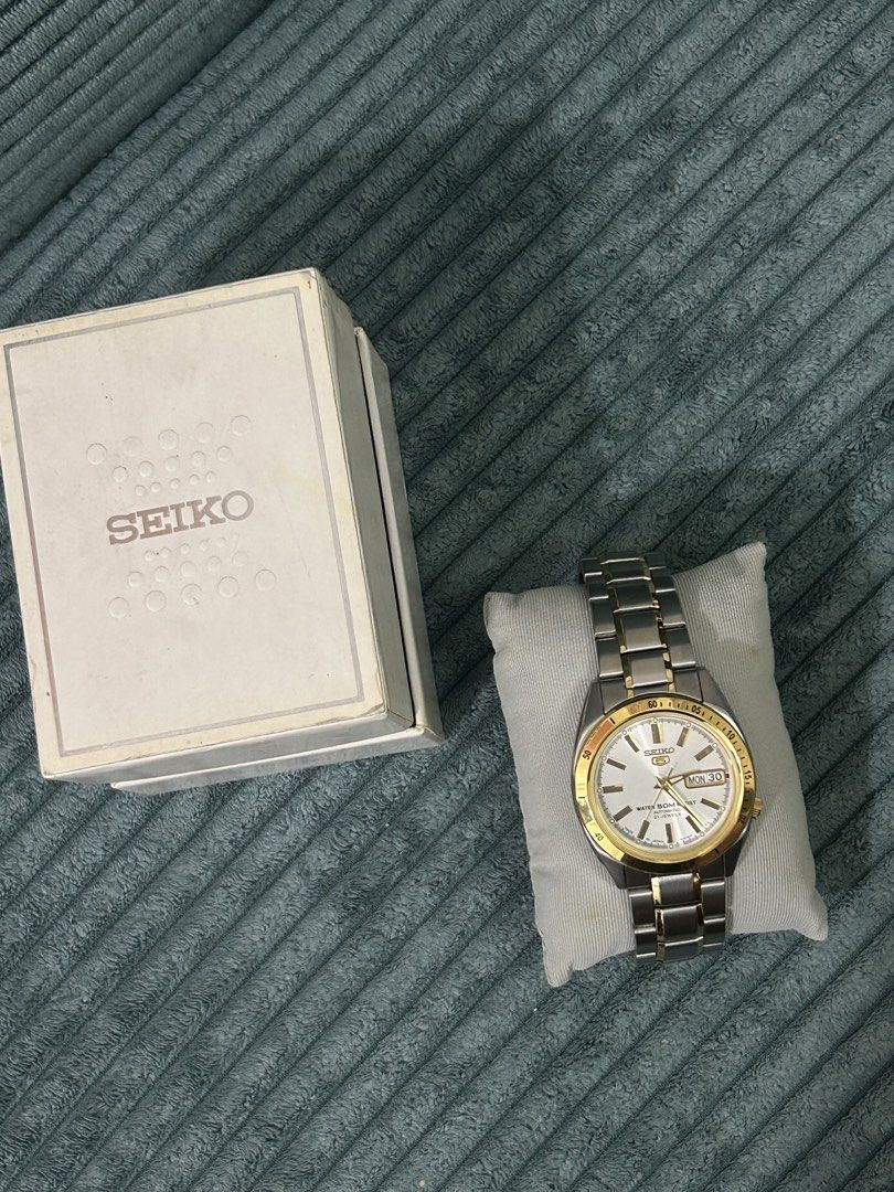 Bnew Seiko 5 Automatic Watch with Dual Tone Gold Silver (Category: Women's Watches) located in Cavite. Submitted by _schmyla (Listing ID 1444082512, Image 2). Description: - Seiko 5 Automatic Watch - Reliable automatic movement - Day and Date display - Elegant silver and gold two-tone stainless steel band - Clean white dial with gold hour markers and hands - Includes original Seiko box - Ideal for everyday wear.