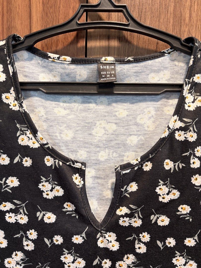 SHEIN Black Floral Mini Dress (Category: Dresses) located in Quezon City. Submitted by lliya_preloved (Listing ID 1443986022, Image 2). Description: - Short sleeves with lettuce trim - V-neckline with a small cutout - Stretchy and very comfortable material - Perfect for casual occasions.