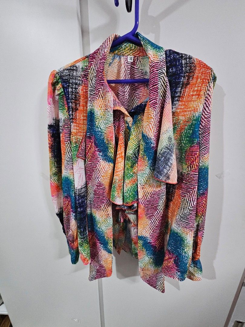 SHEIN Colorful Abstract Print Button-Up Shirt (Category: Blouses) located in Caloocan City. Submitted by rm.diaz (Listing ID 1444059892, Image 1). Description: - Vibrant abstract print SHEIN top - Button-up front - Collared neckline - Textured fabric feel - Adds a pop of color to any outfit - Versatile for casual or dressed-up looks.