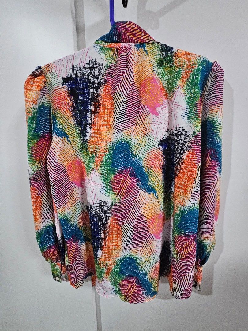 SHEIN Colorful Abstract Print Button-Up Shirt (Category: Blouses) located in Caloocan City. Submitted by rm.diaz (Listing ID 1444059892, Image 3). Description: - Vibrant abstract print SHEIN top - Button-up front - Collared neckline - Textured fabric feel - Adds a pop of color to any outfit - Versatile for casual or dressed-up looks.
