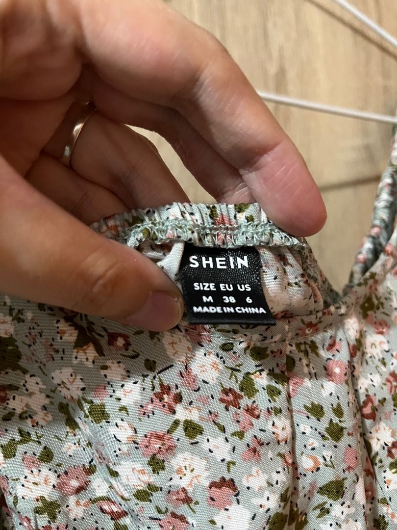 SHEIN Floral Dress (Category: Dresses) located in Cabanatuan. Submitted by declutteringhaven (Listing ID 1443927669, Image 2). Description: WORN ONLY ONCE - Cute floral print dress from SHEIN - Size: Medium (M) - Base color: Light blue with pink and white flowers - Perfect for casual outings or picnics - Condition: Worn only once - Origin: Made in China.