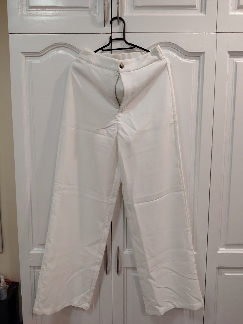 SHEIN White Wide Leg Pants Size S (Category: Other Bottoms) located in Caloocan City. Submitted by jaylynm (Listing ID 1443964910, Image 1). Description: - SHEIN White Wide Leg Pants - Size: S - Material: Polyester & Elastane Blend - Fit: Comfortable and flowy - Versatile: Great for casual or dressed-up looks - Easy to pair with any top.