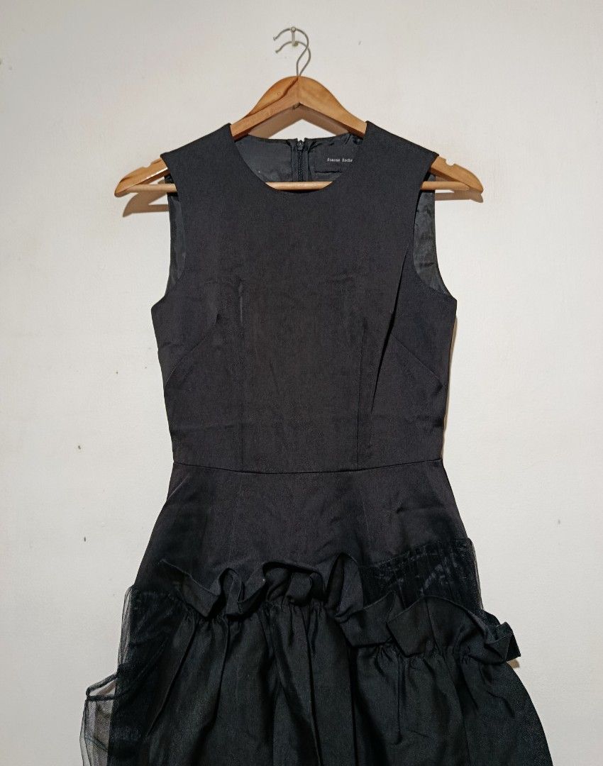 Simone Rocha - Black Sleeveless Ruffled Dress (Category: Dresses) located in San Fernando. Submitted by son.twice.stuff (Listing ID 1444067605, Image 3). Description: Item: Simone Rocha - Tagged Size: UK 6 Fit Small Dimensions Length: 43" Armpit To Armpit: 15" Waistline: 12.5" Shoulder: 13" Condition: Excellent Zipper: YKK Made In Italy Material 70% Polyamide 30% Silk Lining 100% Acetate Price: 6800 Free Shipping.