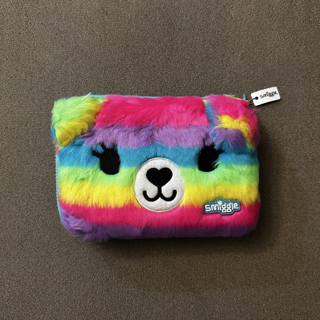 Smiggle Rainbow Furry Bear Pencil Case (Category: Stationery & School Supplies) located in Batangas. Submitted by veevasclutter (Listing ID 1444060223, Image 1). Description: • Smiggle rainbow fur pencil case • interior compartments for pens and a mesh pocket • secure zipper closure • for school or art supplies.