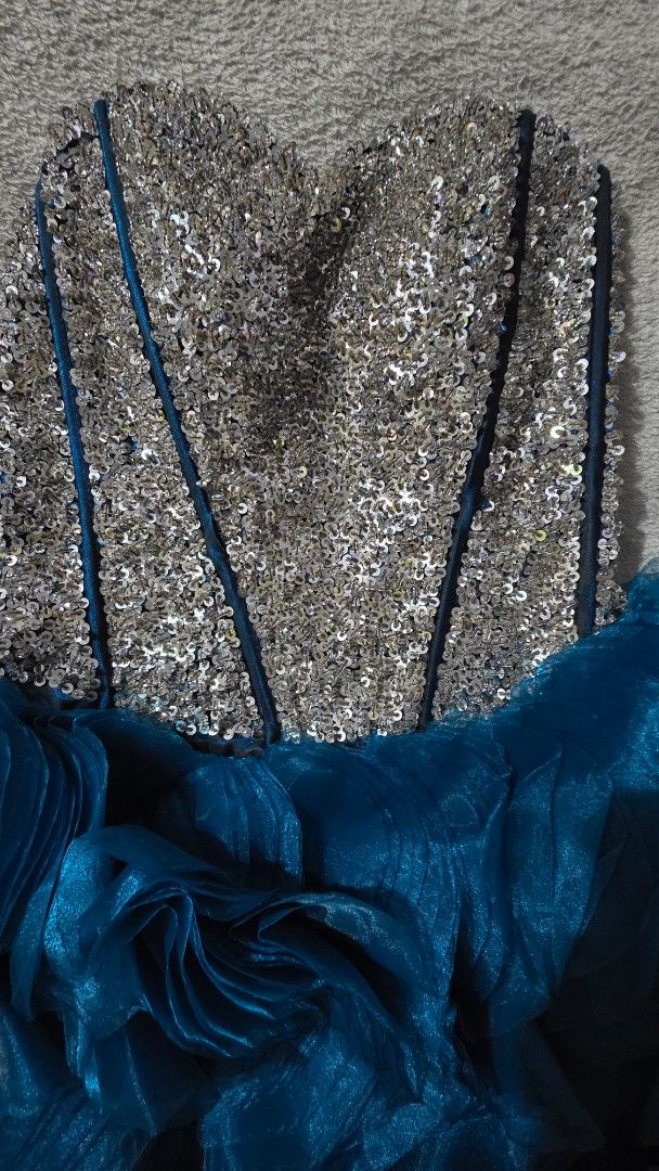 Sparkly Corset Teal Ruffled Ball Gown (Category: Evening dresses & gowns) located in Mandaluyong City. Submitted by mlstuff28 (Listing ID 1443993765, Image 3). Description: - Gorgeous teal ball gown - Sparkly fully sequined corset top - Adjustable lace-up back - Full ruffled skirt made of sheer organza - Perfect for formal events, parties, or prom - Unique and eye-catching design -can fit medium to large frame -need some stitching on the lace Mop
