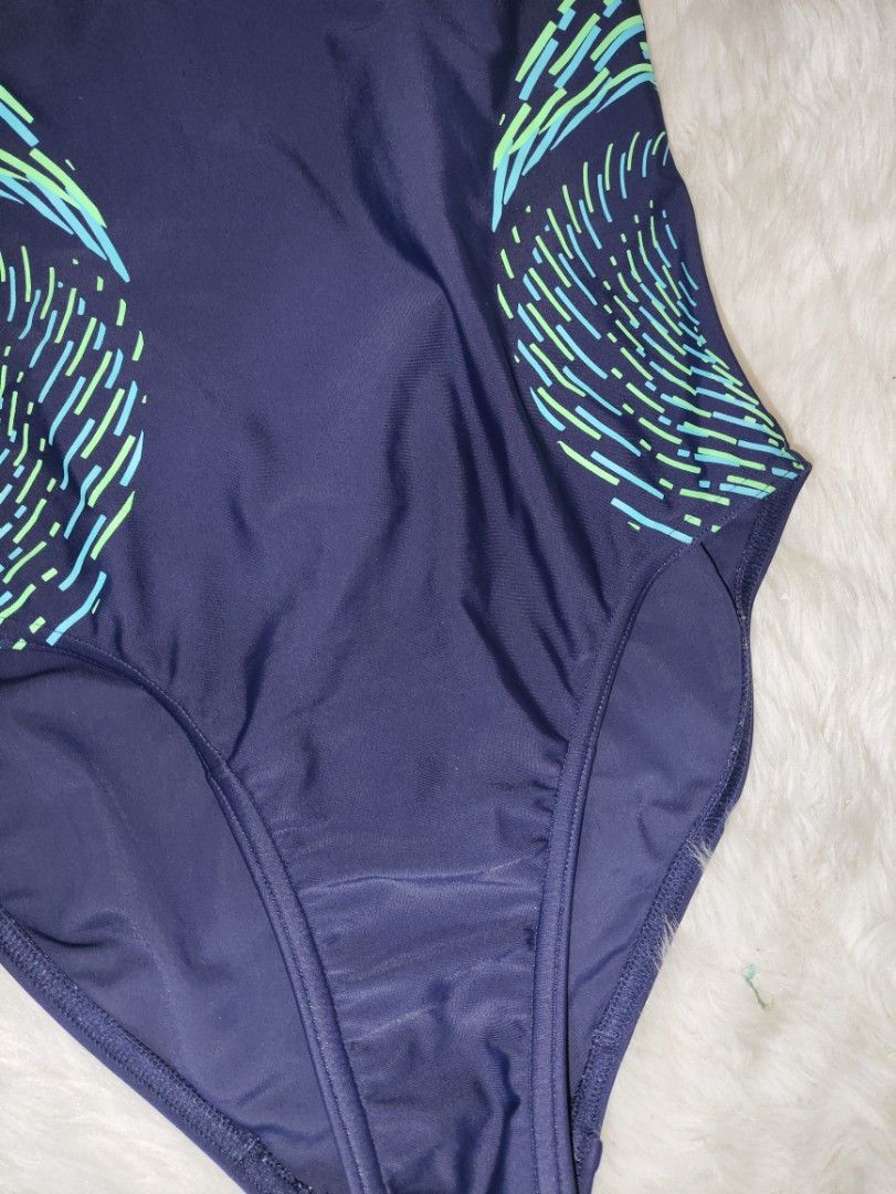 Speedo Navy Blue One-Piece Swimsuit (Category: Other Baby Bathing & Changing Needs) located in Cavite. Submitted by tinetaclesss (Listing ID 1443923805, Image 3). Description: - Navy blue Speedo one-piece swimsuit - Features cool green and blue abstract design on the sides - Racerback style for comfort and support - Ideal for swimming laps or pool lounging - Ready for your next swim!.