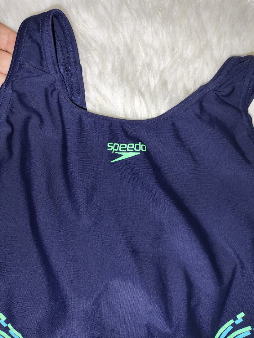 Speedo Navy Blue One-Piece Swimsuit (Category: Other Baby Bathing & Changing Needs) located in Cavite. Submitted by tinetaclesss (Listing ID 1443923805, Image 2). Description: - Navy blue Speedo one-piece swimsuit - Features cool green and blue abstract design on the sides - Racerback style for comfort and support - Ideal for swimming laps or pool lounging - Ready for your next swim!.