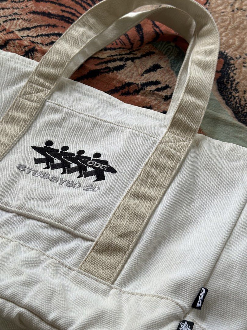 Stüssy x CDG canvas tote bag (Category: Luxury Bags & Wallets) located in Los Banos. Submitted by streetwear.collections (Listing ID 1444072827, Image 2). Description: Stüssy x CDG canvas tote bag Excellent condish Php 11,000 Thanks! .