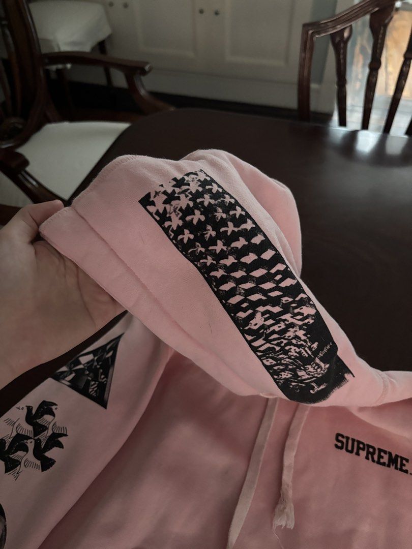 Supreme Pink Graphic Hoodie (Category: Hoodies) located in Manila. Submitted by rosemarywstn (Listing ID 1443924290, Image 2). Description: - Pink Supreme hoodie - Graphic prints on sleeves, front, and back - Noticeable wear at the drawstring.