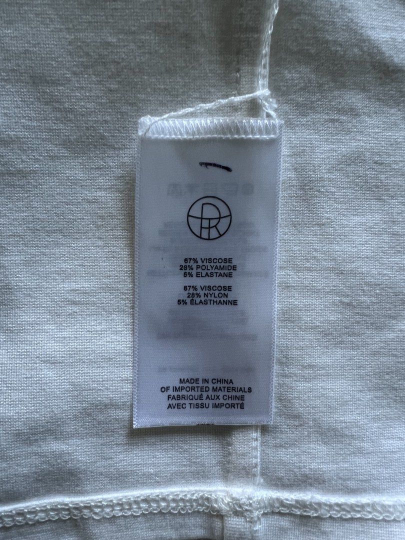 The Row White Viscose Blend T-Shirt (Category: Shirts) located in Manila. Submitted by okgreat (Listing ID 1443961452, Image 3). Description: - Brand: The Row - Color: White - Material: Viscose, Polyamide, Elastane blend (check label for exact composition) - Neckline: Crew neck - Sleeves: Short sleeves - Fit: Comfortable - Style: Basic, versatile, everyday wear - Care: Refer to label for instructions Fits XS-S AUTHENTIC toteme jil sander celine k