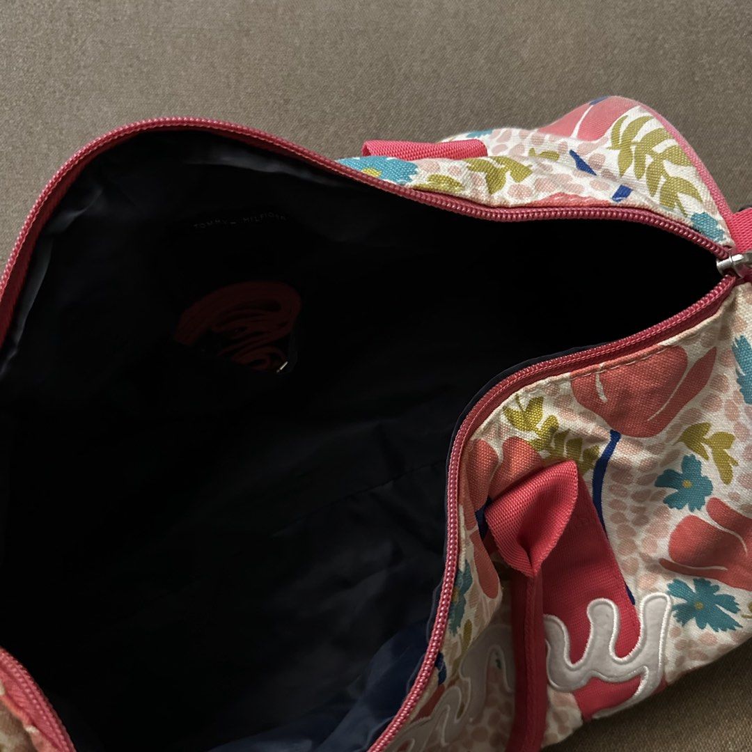 Tommy Hilfiger floral duffel bag (Category: Cross-body Bags) located in Batangas. Submitted by veevasclutter (Listing ID 1444064496, Image 3). Description: • floral/tropical print with pink trim and handles • made of cotton • for trainings and beach getaways.