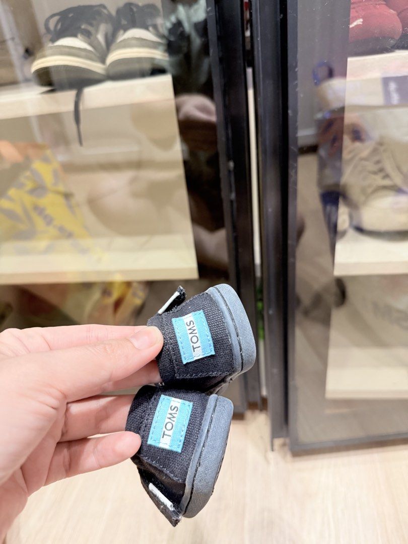 TOMS Baby Shoes (Category: Babies & Kids Fashion) located in Manila. Submitted by kriscongso16506 (Listing ID 1444020961, Image 3). Description: - TOMS baby shoes - Classic slip-on style - Velcro closure for easy on/off - Dark black canvas material - Perfect for little ones - Please check photos for condition details Size: 9cm, eu 17.5, uk1.5, us 2 No box No paperbag.