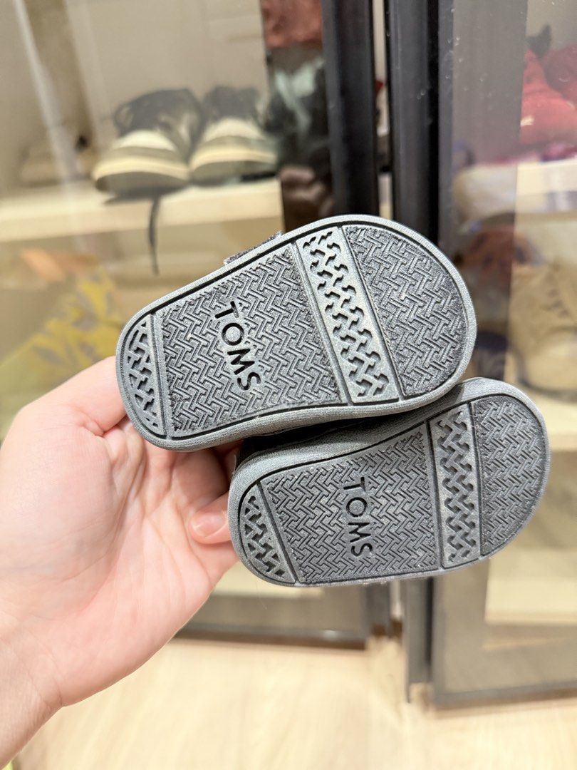 TOMS Baby Shoes (Category: Babies & Kids Fashion) located in Manila. Submitted by kriscongso16506 (Listing ID 1444020961, Image 2). Description: - TOMS baby shoes - Classic slip-on style - Velcro closure for easy on/off - Dark black canvas material - Perfect for little ones - Please check photos for condition details Size: 9cm, eu 17.5, uk1.5, us 2 No box No paperbag.