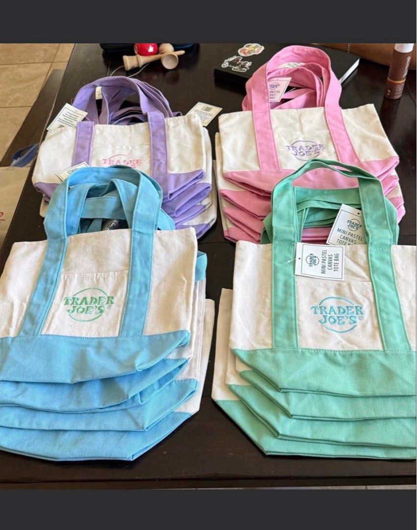 Authentic Trader Joe's Mini Pastel Canvas Tote Bag (Category: Tote Bags) located in Angeles City. Submitted by ushoppes (Listing ID 1443916115, Image 2). Description: - Adorable mini tote bags from Trader Joe's. - Available in charming pastel colors: lavender, pink, light blue, and mint green. - Made of durable canvas material. - Features comfortable handles for easy carrying. - Includes a convenient front pocket for quick access. - Ideal for gro