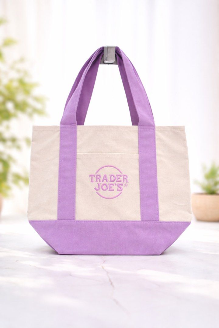 Authentic Trader Joe's Mini Pastel Canvas Tote Bag (Category: Tote Bags) located in Angeles City. Submitted by ushoppes (Listing ID 1443916115, Image 1). Description: - Adorable mini tote bags from Trader Joe's. - Available in charming pastel colors: lavender, pink, light blue, and mint green. - Made of durable canvas material. - Features comfortable handles for easy carrying. - Includes a convenient front pocket for quick access. - Ideal for gro