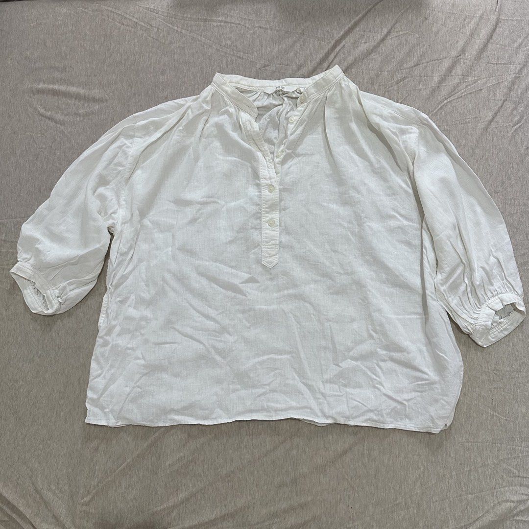Uniqlo White Linen Blend Blouse (Category: Blouses) located in Paranaque City. Submitted by joybeanqt (Listing ID 1443999310, Image 1). Description: - White linen blend blouse - Mandarin collar - Button-up placket - 3/4 length sleeves with gathered cuffs - Relaxed fit - Comfortable for everyday wear - Easy to style.